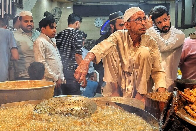 Old Delhi Night Food Tour - Kitchens & Local Stories - Stop 2: Chandni Chowk Market and the vegetarian skewer that plays mind games
